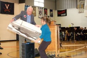 ©™ 2007-2016 Nelson County Life Magazine / Blue Ridge Life Magazine : Photo By Tommy Stafford : Back in November 2007 featured speaker, Captain Jack McNish, (now deceased) Retired U.S. Navy, hands a picture of a submarine to one of the students to show to the audience. McNish told about his time as a commander of the submarine during his time in the Navy.