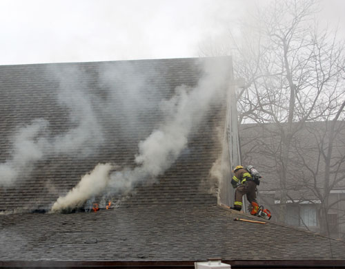 Wintergreen Fireman on roof with flames