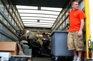 Kris stands next to a huge heap of electronics that started filling the truck.