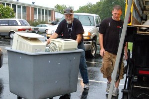 Steve Foster & Kris Kirtley of Crutchfield wheel computer to the recycle truck.