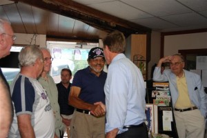 Pete Purdue of Afton shakes hands with Warner at Rapunzel's