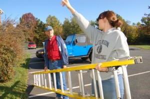 Erin Hopke, pointing, gets help from RVCC board member, Bill Howard, in preparation of APO's community service project.
