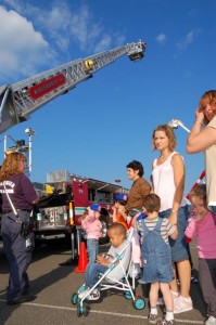 By Tommy Stafford : Members of Wintergreen Fire & Rescue show students at Rockfish River Elementary how they use a ladder truck to fight fires.