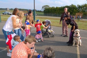 Helene Dodge shows how her K-9 dog is used in search and rescue.