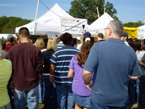 People line up at The Hill Top Berry Farm & Winery tent during the festival.