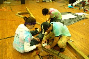 APO members assemble trusses that will be used in the roof of the outdoor pavilion.