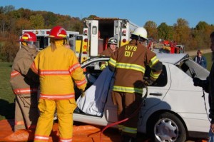 Members of the Lovingston Volunteer Fire Department demonstrate how they get injured people out of a car wreck.