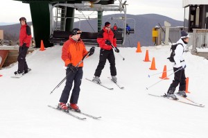 Photos By Paul Purpura ©2008 NCL : Skiers hop off of a lift at Wintergreen for a soft opening on Friday. 