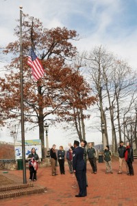 Photos By Paul Purpura : Alonzo Taylor, a Wintergreen Police Officer and Iraq War Vet, raises a special flag at Wintergreen on Veteran's Day.