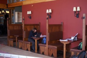 Photos Courtesy DBBC : A food service rep sits in one of the recently completed booths at Devils Backbone Brewery