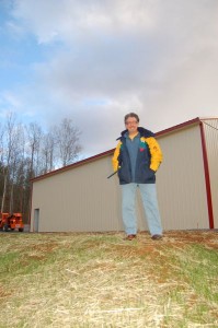 Photos By Tommy Stafford ©2008 NCL : Chris Allwood, co founder of Eades Distillery, stands in front storage on their site.