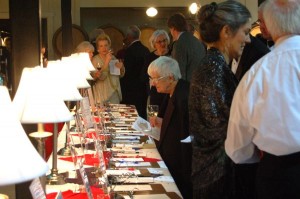 Photos By Tommy Stafford ©2008 NCL : Guests look over the silent auction items at Saturday night's 5th Annual Opportunity Ball held at Veritas Winery.