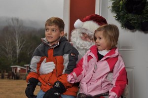Photo By Benjamin Hernandez  : Two youngsters pose with Santa this past weekend at MountainSide Petting Farm.