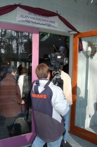 Camera crews from Richmond enter the sanctuary at Synchronicity for Sunday's memorial.