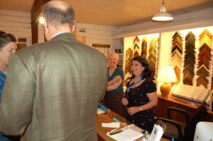 Mary Reid (left) co-owner of Spruce Creek Gallery and Sue Bernard, the founder of the gallery wait on customers in 2007. Ask Sue about the sling!