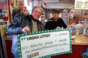©2009 NCL Magazine : Alain San Giorgio (left) shows off his $100,000.00 check with Se. Myomg Lim at Graves Grocery just south of Nellysford, Virginia.