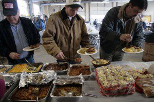 Photos By Hayley Osborne : ©NCL Magazine : 6 tables lined up full of food ranging from deep fried chitlins to mac & cheese to fruit salad at this year's 51st Piney River Vol Fire Dept Chitt’lin Dinner 