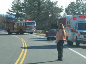 Photos By Ken Harris : ©2009 NCL Magazine Web Edition : Rescue personnel direct traffic around the scene of the accident Tuesday afternoon in Afton along 151.