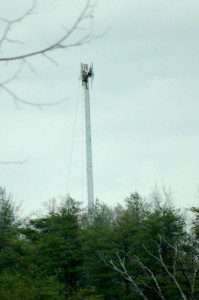 ntelos-tight-crew ©2009 NCL Magazine : A tower crew attaches antennas to the top of the newly installed Ntelos Wireless tower along Route 151 across from Rockfish Presbyterian Church. Click any image for larger view.