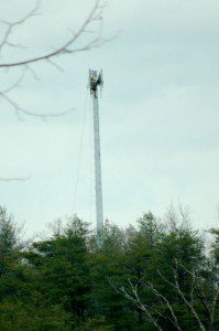 ©2009 NCL Magazine : A tower crew attaches antennas to the top of the newly installed Ntelos Wireless tower along Route 151 across from Rockfish Presbyterian Church. Click any image for larger view.