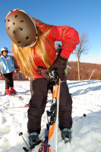 A member of the RRES Ski Club checks out the gear before heading down the slope.