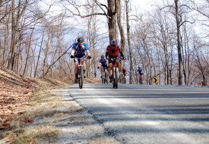 Bikers top the crest at Brent's Gap before heading cross country on the practice run.