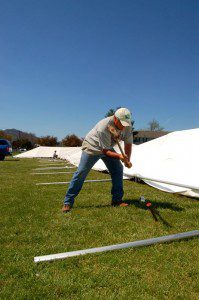 Photos By Tommy Stafford : NCL Magazine : Volunteers worked most of Saturday to put the tent in place for next month's opening of the Nelson Farmers Market Co-op. Click any photo to enlarge.