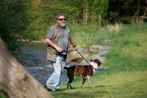 Local photographer, Tom Dennis, takes a stroll with his K-9 friend.
