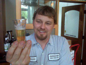 ©2009 NCL Magazine : Devils Backbone Brewmaster Jason Oliver holds up a sample of his latest beer creation. 