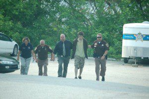 © 2009 Nelson County life Magazine. Photo by Tommy Stafford. 20 year-old Austin Griffin is led into The Nelson County Courthouse on May 11th by Sheriff David Brooks.(far right) Inv. Becky Adcock, Capt. Ron Roberson, and Inv. Paul McCormick accompany Griffin.
