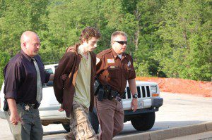 ©2009 NCL Magazine : 20 year old Austin Griffin is lead to a bond hearing Monday afternoon by Augusta County Investigator, Paul McCormick and Nelson Sheriff David Brooks on the far right. Click on any image for larger view.