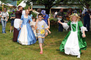 Most of the participants are dressed in period costumes as they demonstrate to the public.