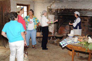 People attending the festival look over the original kitchen and large fireplace at Pharsalia.