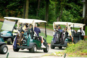 Golfers head to the course at Monday's tournament.