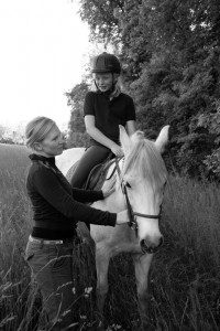 Lindsey Osborne of Rodes Farm Stables works with a youngster on riding technique at Rodes Farm.