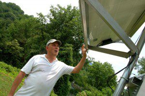 ©2009 NCL Magazine : Photos By Yvette Stafford : Weather enthusiast Kevin Rose, checks his solar panel used to power his Rockfish Weather Station in Eastern Nelson County, Virgina