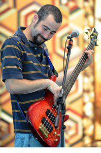 Though not his usual instrument, Cason Ogden, with The Deer Creek Boys plays the electric bass at Saturday's festival.