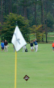 Golfers try for a million dollar hole in one at Friday's golf classic. 