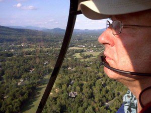 Al Stacey, pilot and owner of Cardinal Helicopters, Inc flies over Nelson County as the final days of Summer play out.