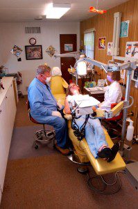 Dr. Michael Sherwood, DDS and assistant, Peggy Saunders work on a patient in the Nelson Dental Clinic Trailer based at The Rockfish Valley Community Center in Afton, Virginia.