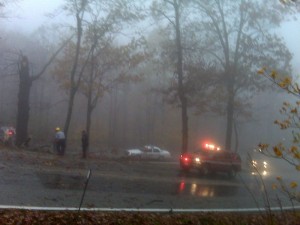 Photo By Paul Purpura : ©2009 www.nelsoncountylife.com : Rescue & Police block Wintergreen Drive early Saturday morning while crews saw up a tree that fell acoss the roadway. 