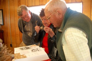 Earl along with his real life sister, Audrey and Paul Saunders look at a picture of Audrey she discovered in Paul's book, Heartbeats of Nelson. 