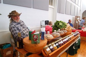 A vendor dsiplays one of his many homemade jams , jellies & preserves. 