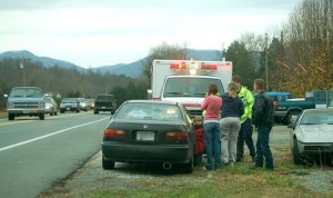 Medics tend to the people involved in the accident. 