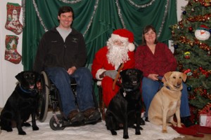 ©2009 www.nelsoncountylife.com : Photo by Diana Garland : Santa poses with Blue Moon owners, Larry Whitaker (left) and Judy Barnes and their pets at the annual Paws With Claus SPCA benefit.