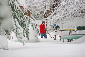 By Woody Greenberg : Conny Roussos shovels out.