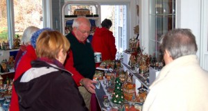 Bobby Rose shows off a small part of his extensive Dickens Village display as part of The Christmas House Tour. 