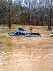 Photo By Ray Uttaro : Crews work to rescue a stranded driver along Rockfish River Road (Route 617) headed toward Schuyler on Monday afternoon. 