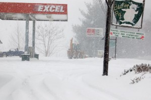 A driver works to clear the lot at Wintergreen Grocers (Valleymont) in Nellysford on Saturday. 