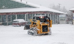 A driver works to clear the lot at Valley Green Center in Nellysford.